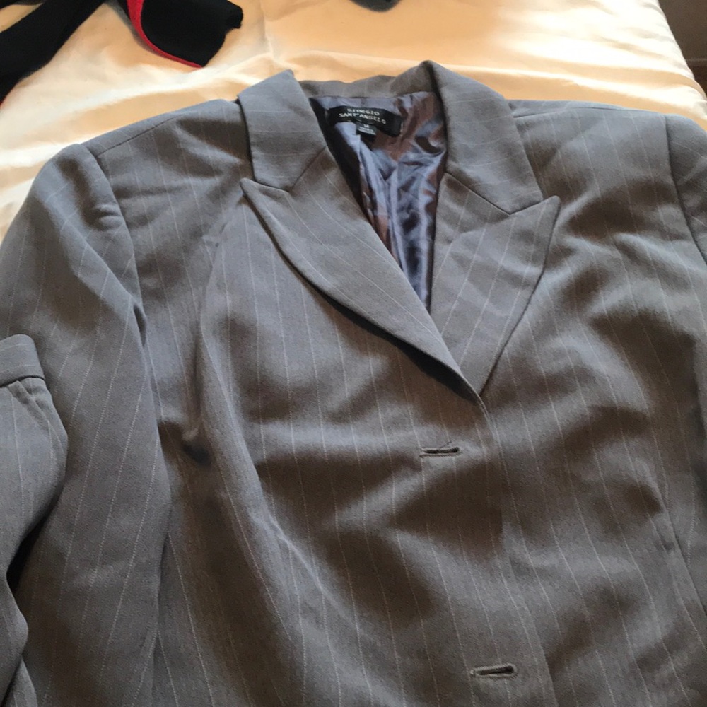 Woman’s suit jacket and paints brand new.